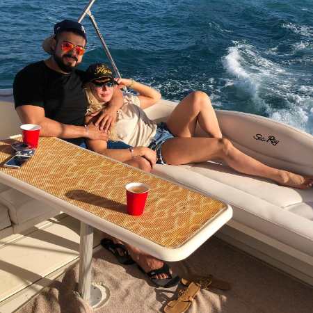 Charlotte Flair and her spouse in a ship spending some quality time.